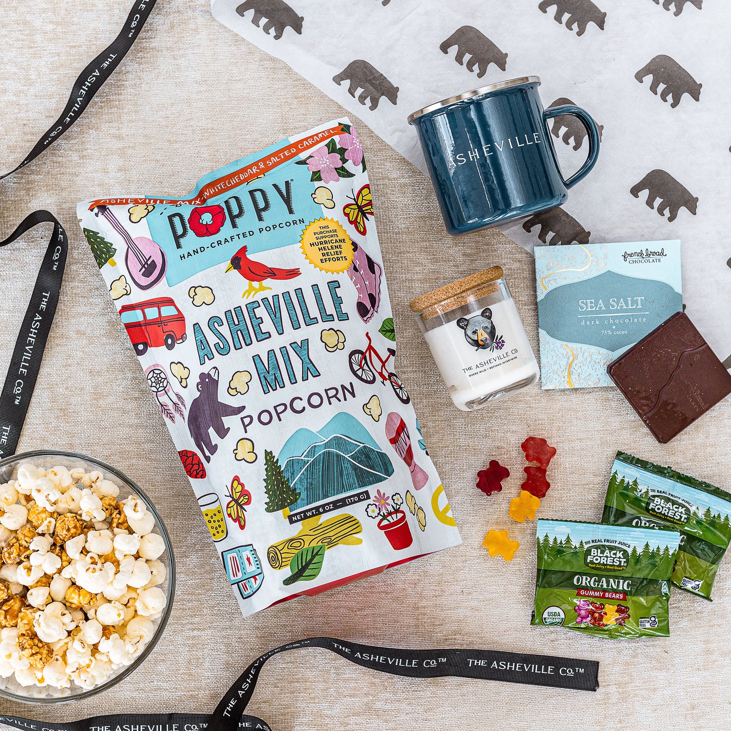 Asheville Gift Bundle Poppy Popcorn, French Broad Chocolates, The ASHEVILLE Co. Enamel Camper Mug and Candle