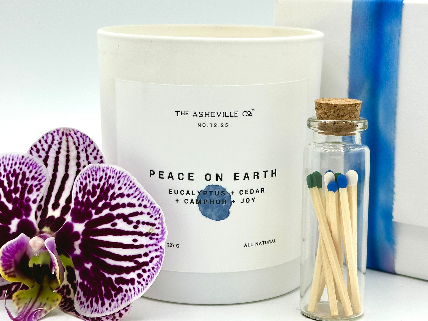 Peace on Earth Luxury Candle White Vessel Match Jar and Orchid bloom