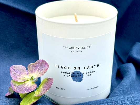 Peace on Earth Luxury Candle with hydrangea bloom and blue background