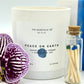 Peace on Earth Luxury Candle White Vessel Match Jar and Orchid bloom 